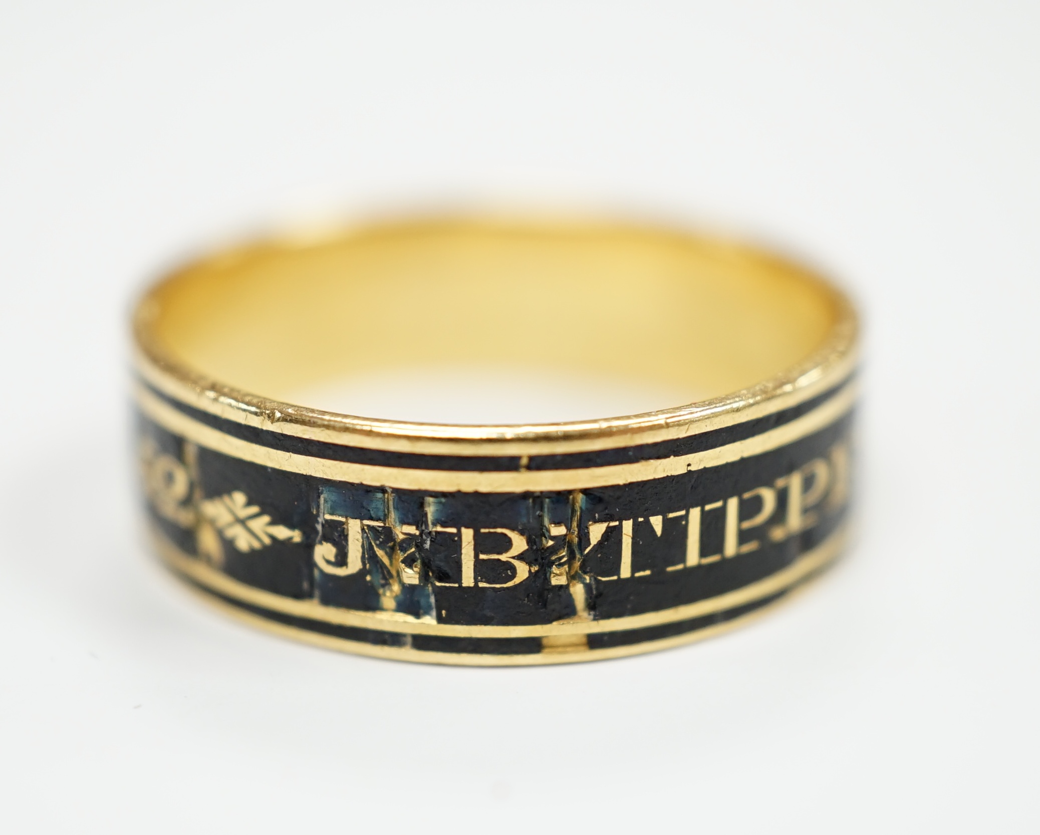 A George III yellow metal and black enamel set mourning band, inscribed ' J.B. Tippetts ob.28 June, 1782, ae.52', size P, gross weight 4.9 grams.
